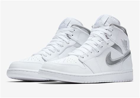 Metallic Silver Accents On This All White Air Jordan 1 Mid