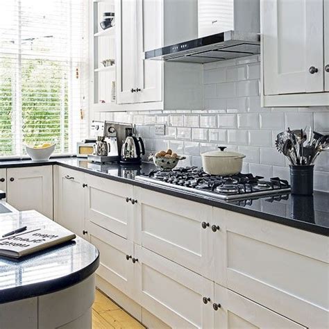 Browse our laminate kitchen worktops and upstands to choose the design that suits you. White kitchen with black worktop | White kitchen black ...