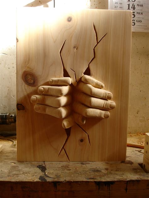 Wooden Sculpture Made By S Carving Hands Out Of The Wall Wood