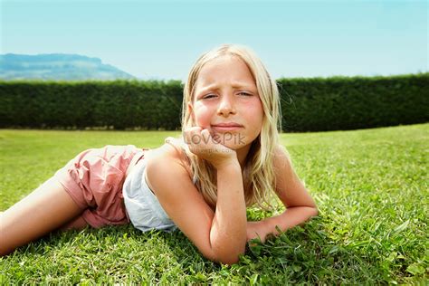 Curious Girl Lying On The Grass Picture And Hd Photos Free Download