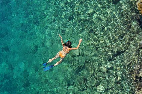 sexy woman snorkeling — yacht charter and superyacht news