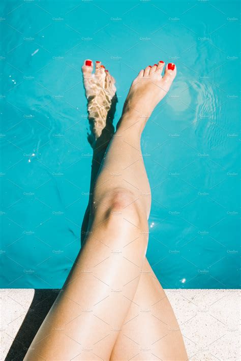 Legs Of A Woman Sitting In A Pool High Quality People Images ~ Creative Market