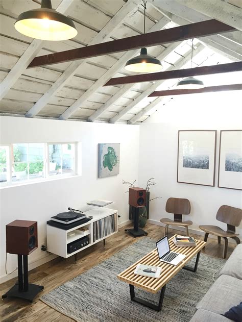This garage conversion blends a home office and a small seating area complete with a couch for guests. New Listening Room / Garage Conversion in 2020 | Garage ...