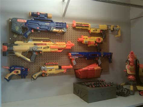 We had the idea to build a secret diy nerf storage wall in his bedroom. Nerf gun wall display | bedroom ideas | Pinterest | Nerf ...