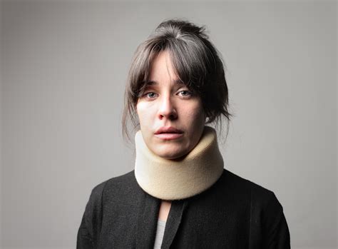 Woman Wearing A Neck Brace Horizon Therapy Services