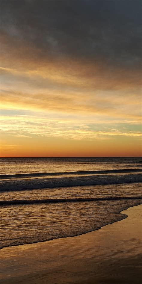 Download Wallpaper 1080x2160 Sunset Beach Sea Waves Calm And Clean