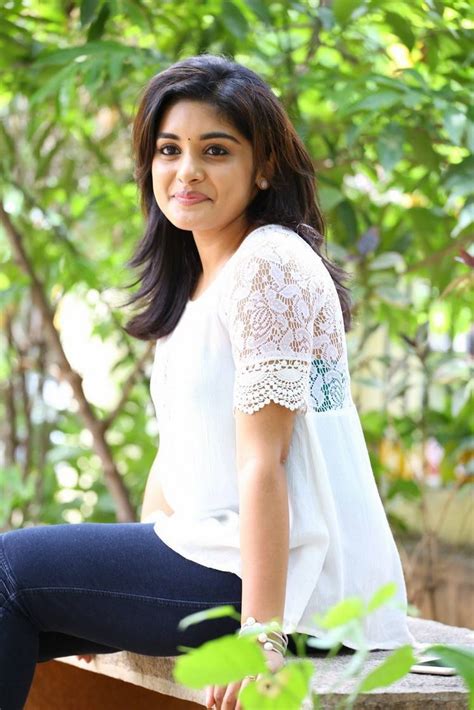 niveda thomas latest hot spicy glamour photoshoot images in white top images