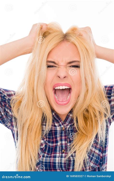 Close Up Portrait Of Angry Woman Screaming And Holding Head Stock Image