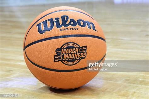 Sweet 16elite 8 March Madness Logo On A Basketball Before The Sweet