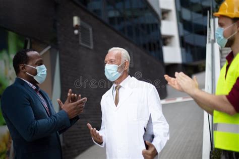 Doctor Engineer And Businessman Keeping Eyes On You Stock Photo