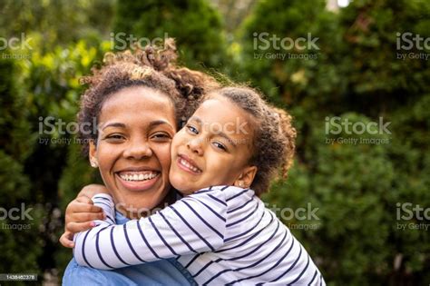 Close Up Portrait Of Mother And Daughter Stock Photo Download Image