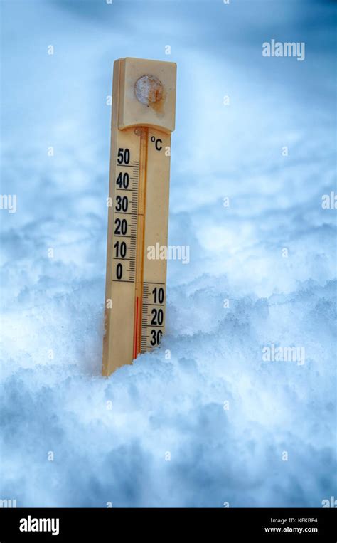 Thermometer On Snow Shows Low Temperatures Stock Photo Alamy
