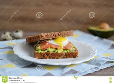 Sandwich With Avocado Smoked Salmon And Quail Egg Stock Photo Image