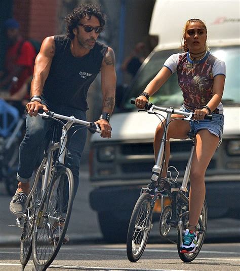 Leon Lourdes Riding Her Bicycle Along With Her Father Carlos Leon