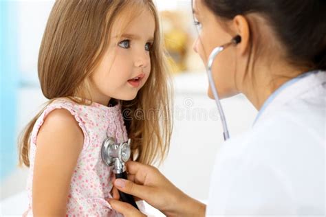 Doctor Examining A Little Girl By Stethoscope Stock Photo Image Of