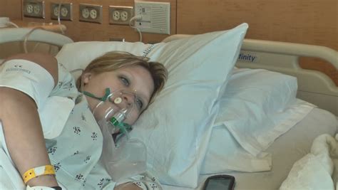 a sick woman wearing an oxygen mask lying in a hospital bed stock footage video 4303778