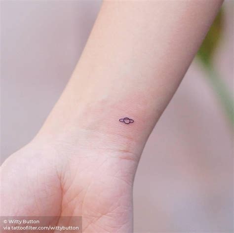 Tiny Saturn Tattoo On The Wrist In 2020 Saturn Tattoo Tiny Wrist