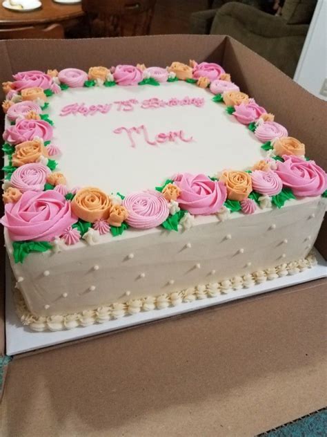 A Birthday Cake In A Box With Roses On It