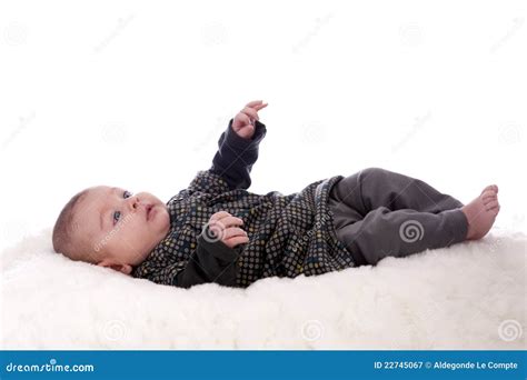 Baby Lying On His Back Looking Up Royalty Free Stock Photography