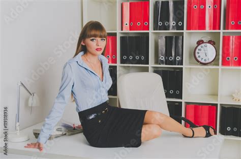 Beautiful Seductive Secretary Sits On Your Desk Buy This Stock Photo And Explore Similar