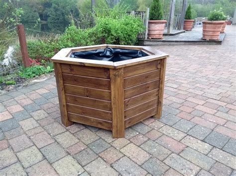 Aston Hexagonal Wooden Planters Stained With Warm Oak Woodstain