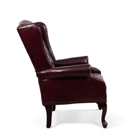 Wingback chairs were invented in the 17th century to be fireside chairs—i.e. Burgundy Tufted Leather Wing Back Chairs For Sale at 1stdibs