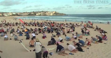 Australians Bury Heads In Sand To Mock Government Climate Stance The