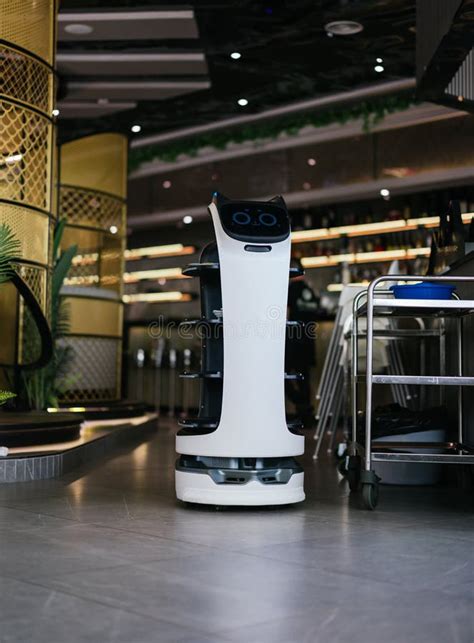 Robot Waiter Serving Food In A Restaurant Stock Image Image Of Design