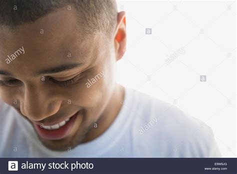 Close Up Portrait Of Smiling Man Looking Down Stock Photo Alamy