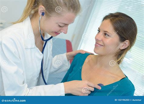 Doctor Female Listening To Patient Heartbeat With Stethoscope Stock