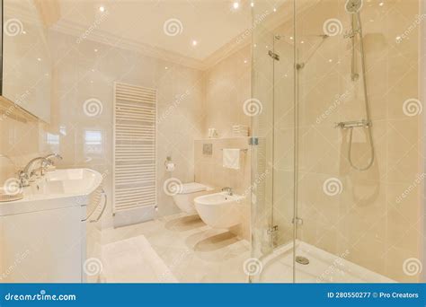 A White Bathroom With A Shower Toilet And Sink Stock Image Image Of