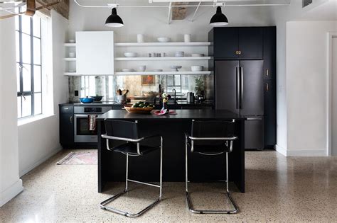 In an unglazed finish, terracotta floor tiles add more warmth than slate or stone, yet are timeless classic. A Mirrored Backsplash and Terrazzo Flooring Lighten Up This Historic Kitchen | Architectural Digest