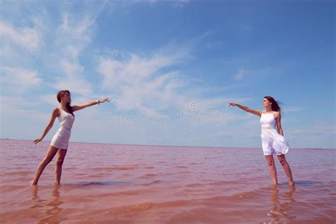 Two Hot Brunettes In A White Dresses Posing Near The Lake Stock Image Image Of Background