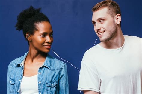 Premium Photo Couple Interracial Music Listen Earphones Enjoy Smile