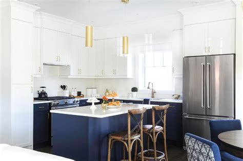 Kitchen accessories in traditional shades of blue and white get refreshingly modern updates. Gold Lights Over Blue Kitchen Island - Transitional - Kitchen