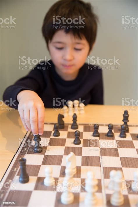 Little Boy Playing Chess Stock Photo Download Image Now 4 5 Years