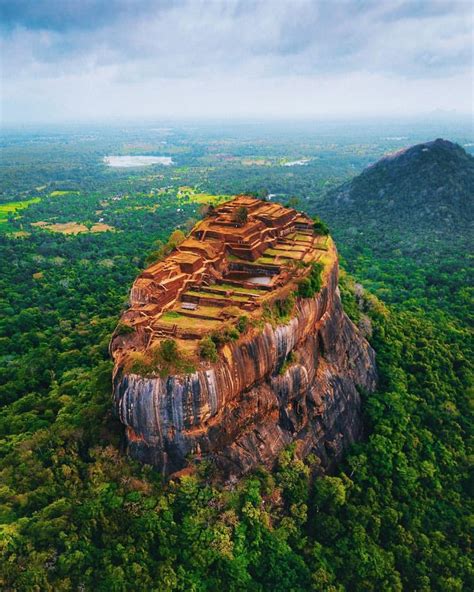 Sigiriya Fortress Rising From The Jungle Canopies Of Sri Lankas