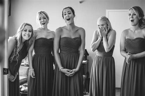 bridesmaids reaction to seeing the bride for the first time bridesmaid bride wedding photography