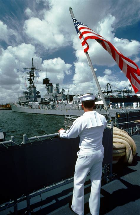 A Sailor Looks Over The Railing At The Guided Missile Destroyer Uss