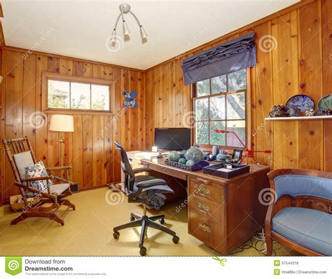 Traditional Home Office With Wood Panel Walls Stock Photo