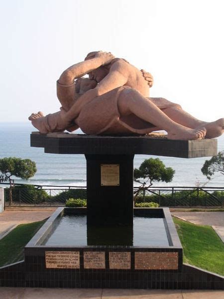 A Sculpture Of People Making Out Photo