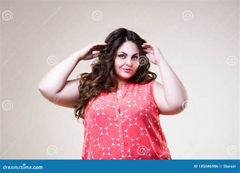 happy plus size fashion model in casual clothes cheerful fat woman on beige background stock