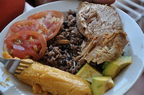 Cuban Food Pork Roast With Trimmings Cuban Cuisine Cuban Recipes