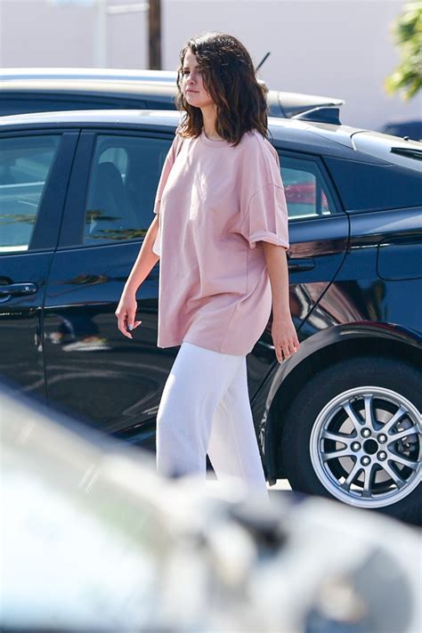 Selena Gomez Wears Pink Shirt And Sweatpants In Los Angeles Pics