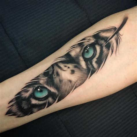 Tiger Eyes Feather Tattoo Tattoo Ideas And Inspiration Frankfanti