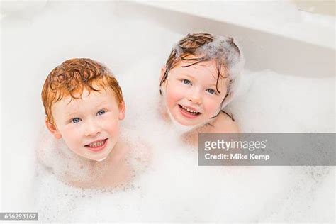 brother and sister taking a bath photos and premium high res pictures getty images