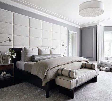 Wooden dark walls fire treated with cozy faux skin upholstery on metal wrought bed frame and candles on the. Padded wall panels in the bedroom - outstanding accent ...