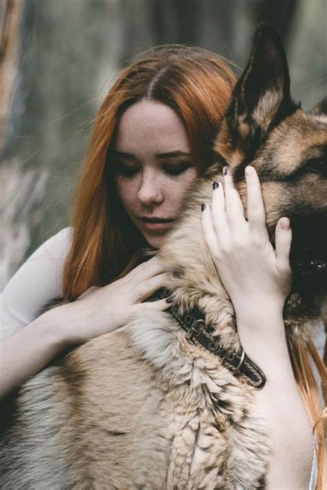 Red Haired Girl With Freckles Hugs German Shepherd Mastiff In The