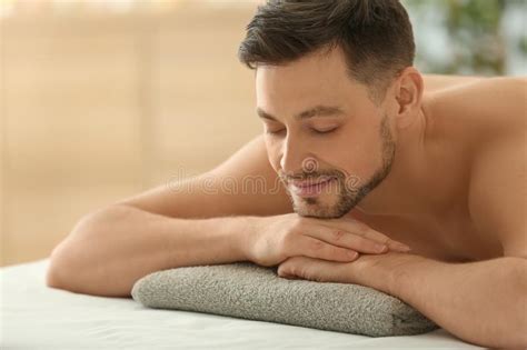 Man Lying On Massage Table In Spa Salon Stock Image Image Of Service Beauty 150038603