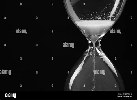 Hourglass On Black Background Stock Photo Alamy